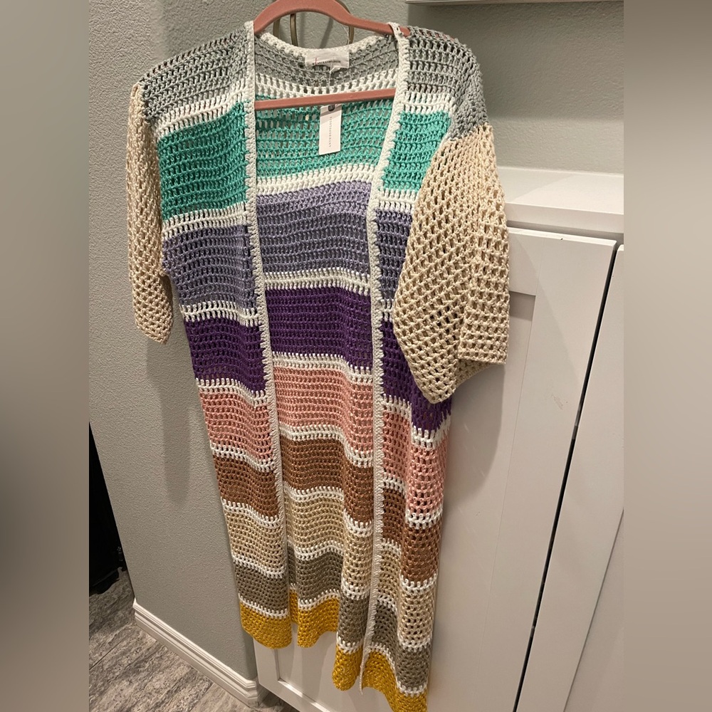 Multi colored crochet long  cardigan  or swim cover up.